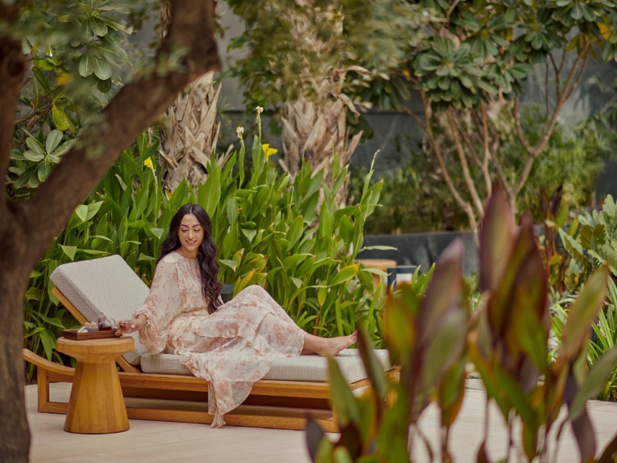 Hotel Grand Hyatt Kuwait Kuwait City Esterno foto A guest at the pool
